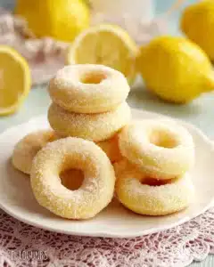 Lemon Sugar Baked Donuts 3 Delicious lemon sugar baked donuts topped with vibrant lemon zest.
