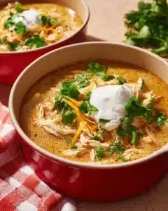 Simple Keto White Chicken Chili 7 Bowl of Simple Keto White Chicken Chili topped with fresh herbs