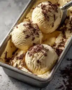Delicious homemade tiramisu ice cream served in a bowl with chocolate shavings