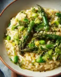 Asparagus Risotto for Spring — Creamy, Quick Weeknight Meal 6 Creamy asparagus risotto served in a white bowl for a spring weeknight meal.