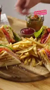 Delicious club sandwich with turkey, bacon, lettuce, and tomato on toasted bread