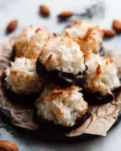 Freshly baked coconut macaroons on a plate, golden and chewy