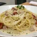 Plate of creamy spaghetti carbonara with cheese and pancetta