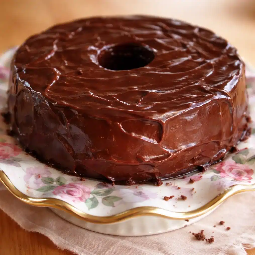 Decadent Oreo Strawberry Cream Bundt Cake with rich strawberry cream frosting.