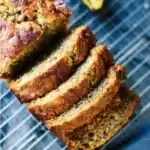 Healthy whole wheat banana bread with ripe bananas and nuts on a wooden table