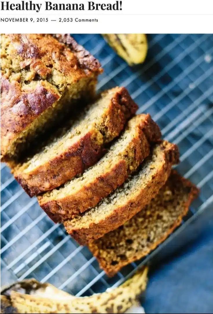 Healthy Whole Wheat Banana Bread 1 Healthy whole wheat banana bread with ripe bananas and nuts on a wooden table