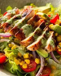 Bowl of fresh Lemon Chicken Salad with colorful vegetables