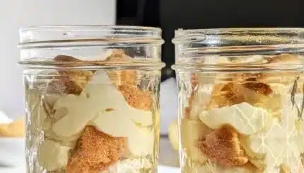 Delicious protein banana pudding served in a bowl with banana slices and whipped cream.