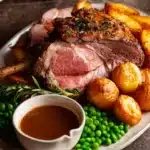 Roast Lamb Leg with Gravy served on a platter