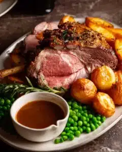 Roast Lamb Leg with Gravy served on a platter
