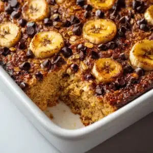 banana chocolate chip baked oatmeal hero shot 45 degree angle on bright table