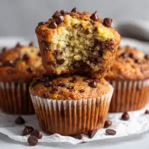 banana chocolate chip muffins hero shot 45 degree angle on bright table