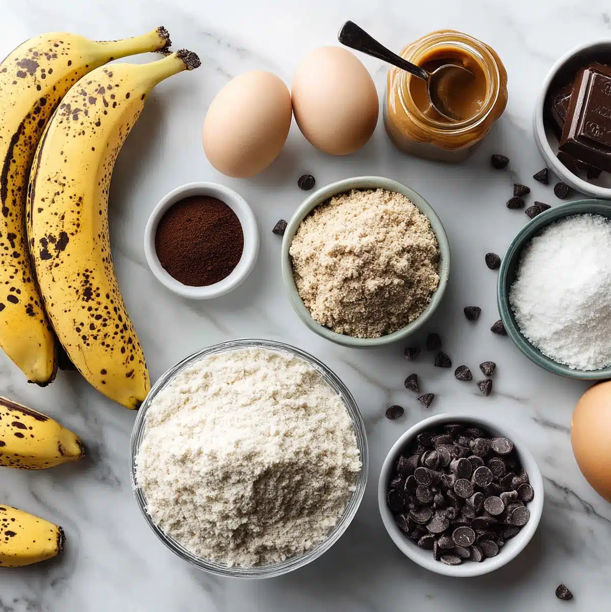 gluten free banana chocolate chip bread ingredients flat lay with almond flour and ripe bananas