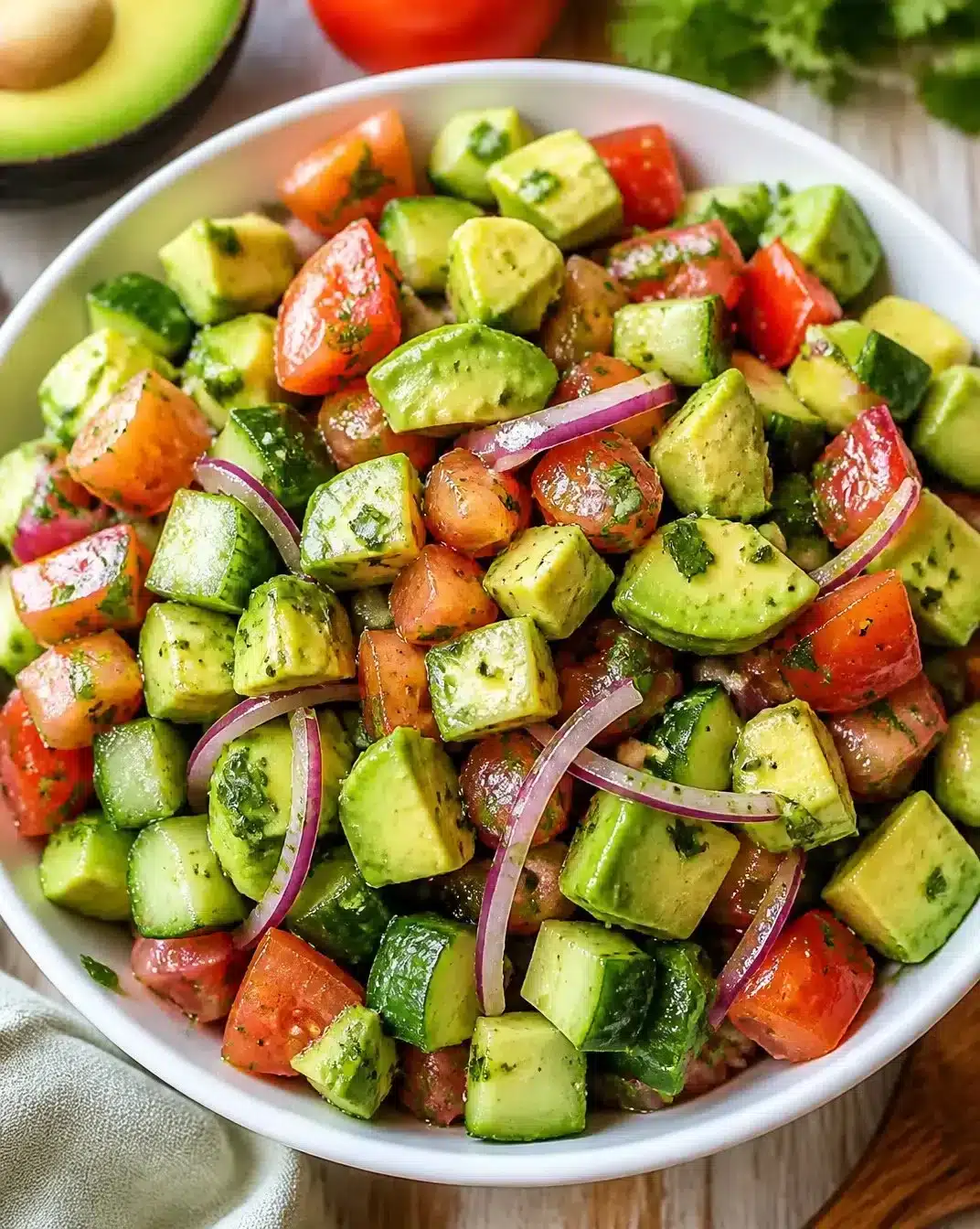 Fresh Avocado Salad with colorful vegetables and dressing