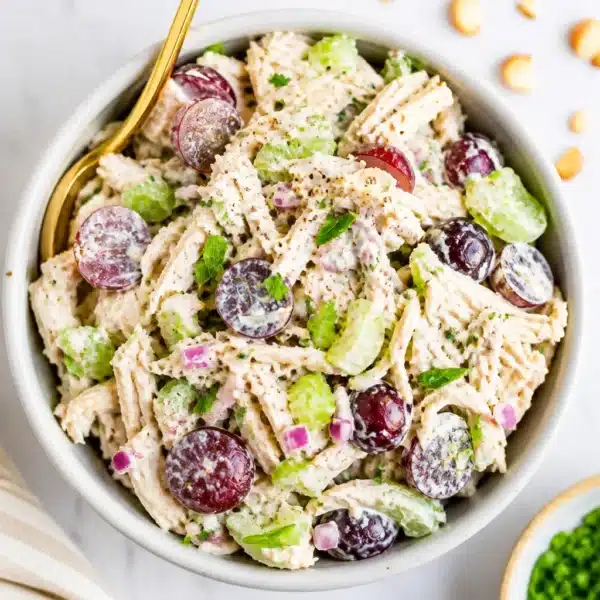 Delicious Greek yogurt chicken salad served in a bowl with fresh ingredients.