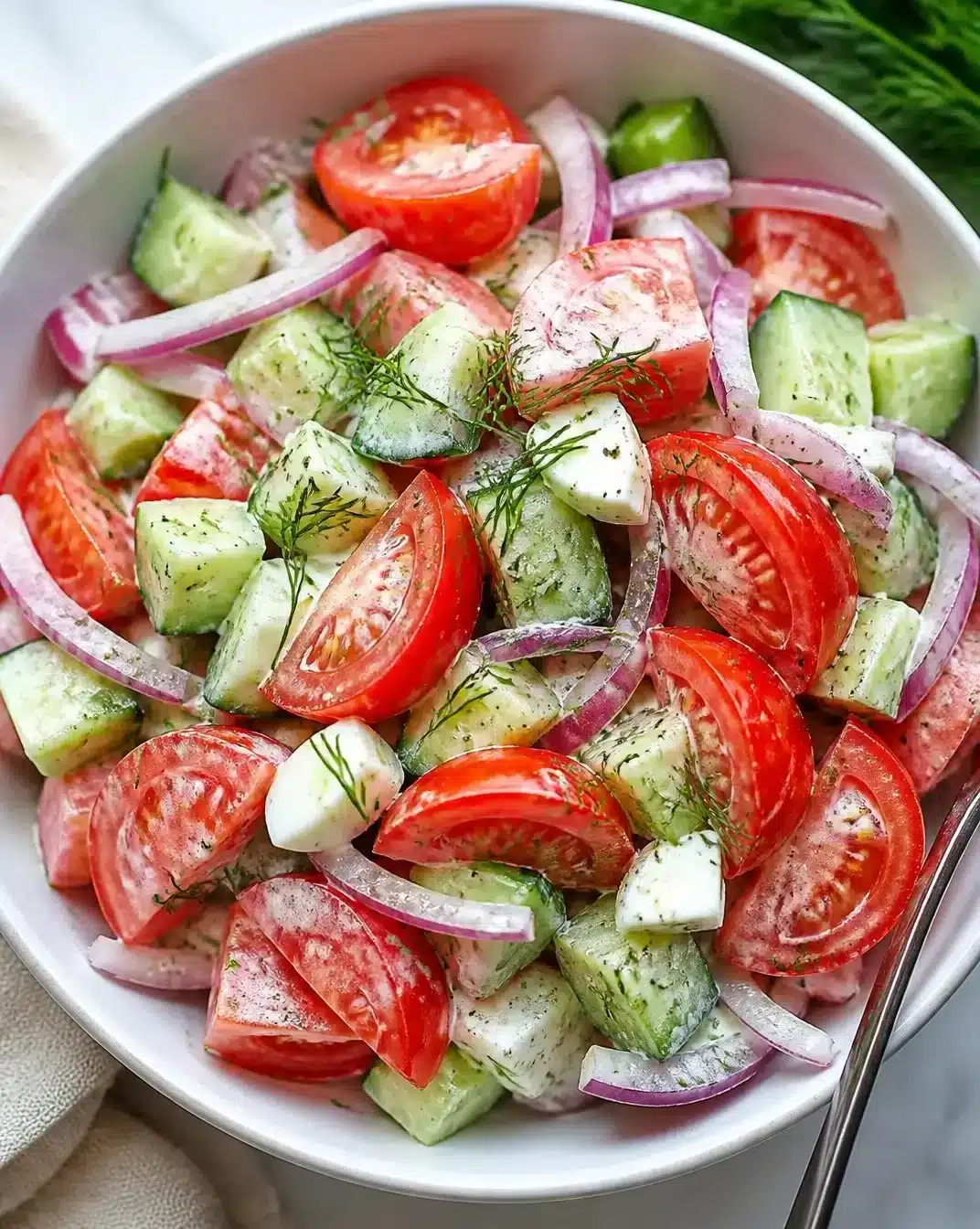 Fresh and colorful simple tomato salad displayed in a bowl
