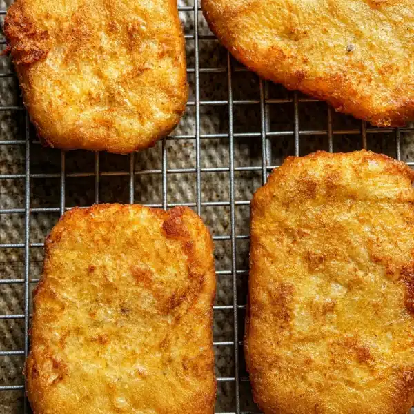 Homemade copycat McDonald's hash browns served golden-brown and crispy.